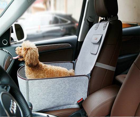 Light grey pet car seat with brown trim on a car's front passenger seat, holding two small dogs. Includes a black pet seatbelt tether. - Image 14