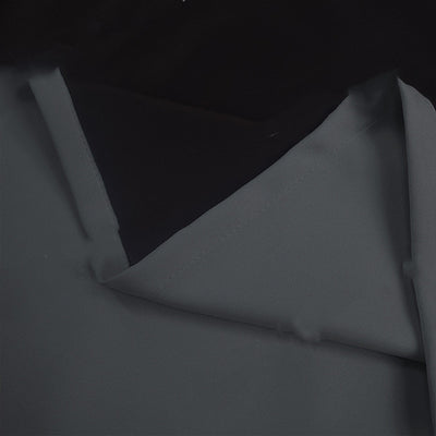Close-up of a navy blue blackout curtain, showcasing the fabric texture and the black lining on the back. - Image 13