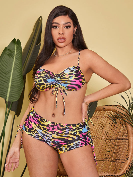 Plus-sized bikini swimsuit with vibrant multi-colored animal print, pleating, and drawstring details. - Image 8