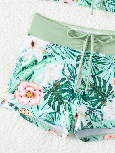 Women's light green two-piece bikini swimsuit with tropical floral and pineapple print, featuring drawstring top and shorts. - Image 12