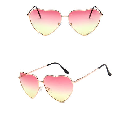 Gold frame heart-shaped sunglasses with transparent yellow lenses and black earpiece tips. - Image 9
