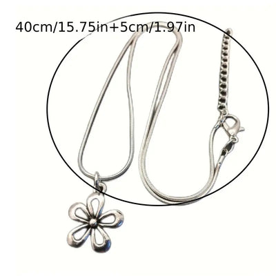 Silver-colored snake chain necklace with a delicate flower pendant and an adjustable lobster clasp closure. - Image 6