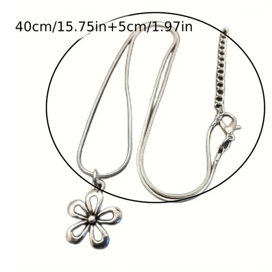 Silver-colored snake chain necklace with a delicate flower pendant and an adjustable lobster clasp closure. - Image 6