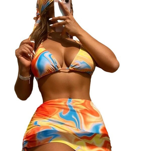 Four-piece tie-dyed bikini swimsuit set in orange, yellow, and white, with a triangle top, high-cut bottoms, ruched mini skirt, and matching headscarf. - Image 5