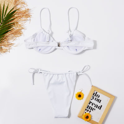 White two-piece underwire swimsuit with a front tie bikini top and adjustable string bottoms, displayed flat. - Image 10