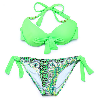 Hot pink halter bikini top with front knot and gold beads, paired with a colorful paisley tie-side bikini bottom. - Image 2