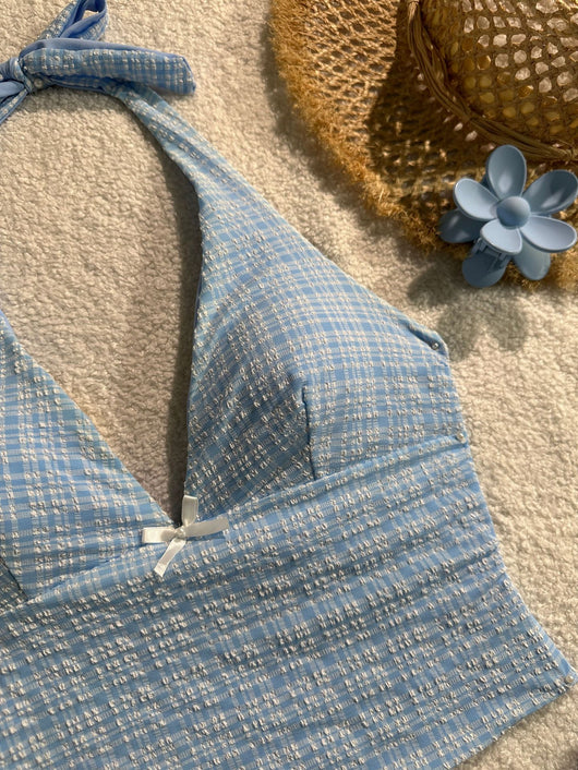 Light blue textured plaid two-piece swimsuit with a halter top and side-tie bikini bottoms, featuring small white bows. - Image 10