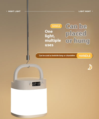 White rechargeable LED table lamp with a digital clock display and a light gray carrying handle. - Image 22