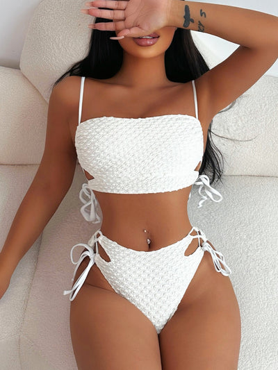 Creamy-white textured two-piece swimsuit with a bandeau top and high-waisted bottoms featuring side ties and cut-outs. - Image 10