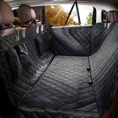 Black quilted Oxford cloth car pet mat installed in a car's rear seat, featuring a hammock design with side flaps. - Image 7