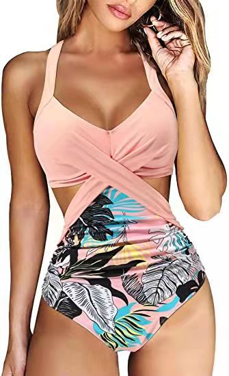 Women's teal halter bikini top with a twisted front and high-waisted bottoms featuring a blue and green tropical leaf print. - Image 10