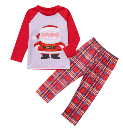 Family of five wearing matching red and grey Christmas pajamas with Santa Claus print tops and red plaid pants. - Image 5