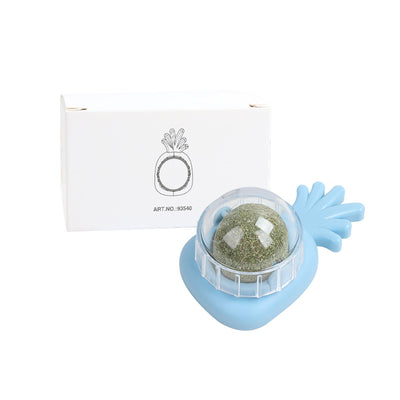Orange carrot-shaped cat toy with a clear dome holding a rotating catnip ball, next to its white packaging box. - Image 9