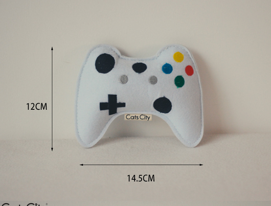 Light blue felt catnip toy shaped like a game controller with piano keys and a black string for hanging. - Image 9