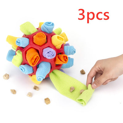 Red rubber pet sniff ball with pink, purple, and dark purple fleece rolls, featuring a treat-holding strap. - Image 12