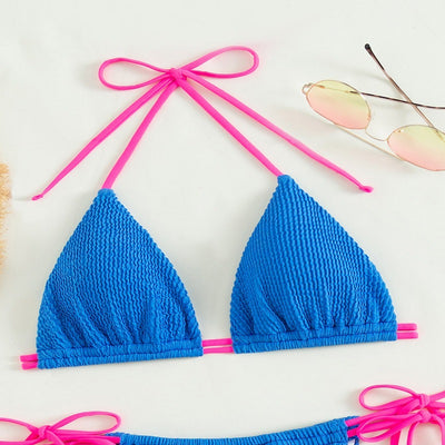 Women's purple textured two-piece swimsuit with light blue lace-up ties, featuring a triangle bikini top and thong bottom. - Image 14