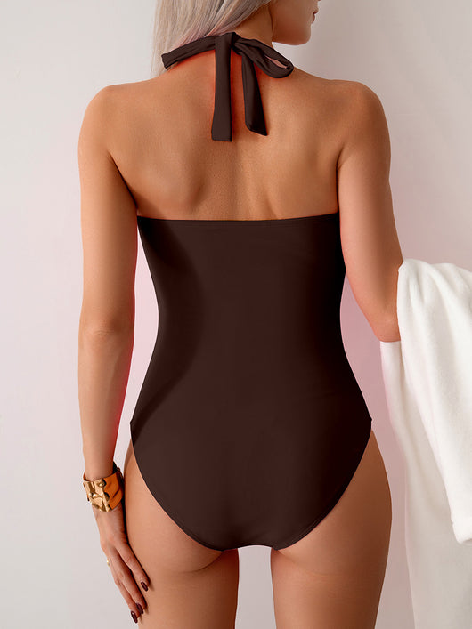 Women's pink one-piece swimsuit with a halter neck, twisted front detail, and ruched sides. - Image 34