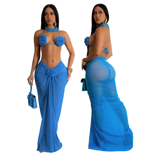 Blue three-piece bikini set with floral appliques on the triangle top, thong bottom, and matching ruched maxi skirt. - Image 17