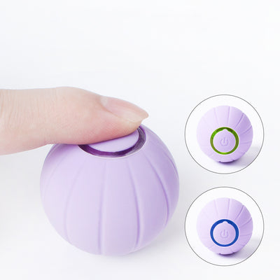 Orange smart bouncing rolling silicone ball toy for cats, shown with its white packaging box and a white USB charging cable. - Image 5
