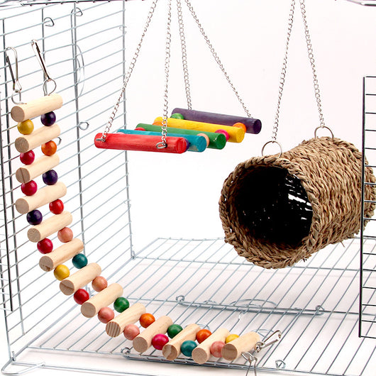 Small animal cage accessories including a flexible wooden ladder with colorful beads, a colorful wooden swing, and a woven grass tunnel. - Image 3
