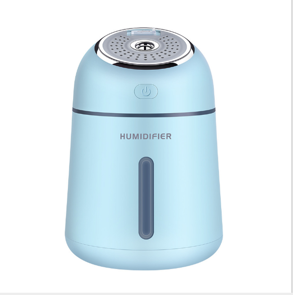 Light blue mini ultrasonic humidifier with a silver top, power button, and clear water level indicator. - Image 5