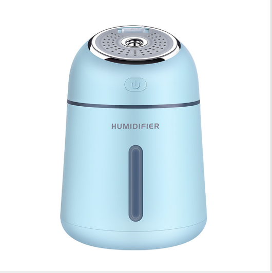 Light blue mini ultrasonic humidifier with a silver top, power button, and clear water level indicator. - Image 5