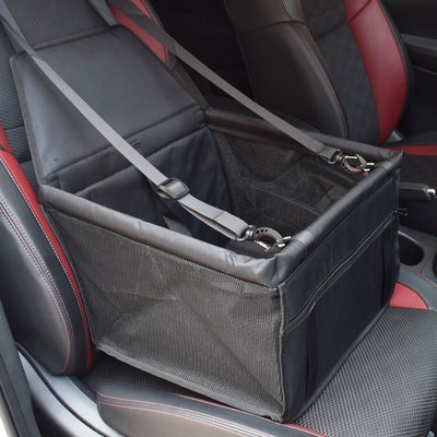 Light grey pet car booster seat with black mesh sides and adjustable straps, installed on a black and red car seat. - Image 5
