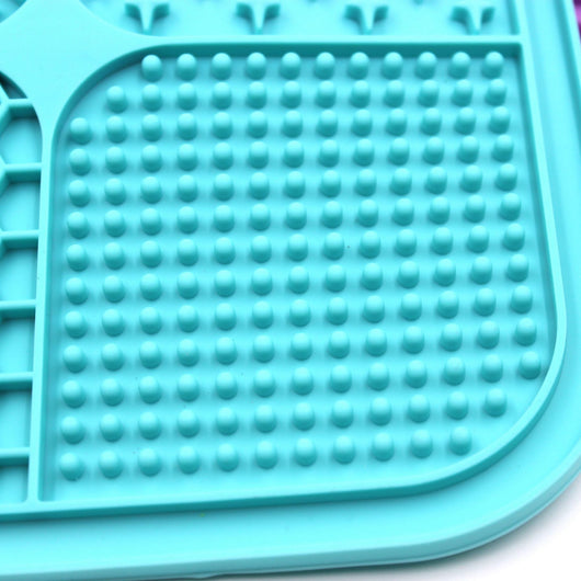 Gray silicone pet licking pad with four textured sections, designed for slow feeding and anti-choking. - Image 42