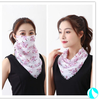 White women's UV protection scarf with black speckle pattern, worn as a face mask and neck scarf. - Image 6