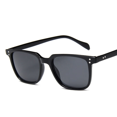 Classic retro midin sunglasses with a black and white striped frame and dark square lenses. - Image 12