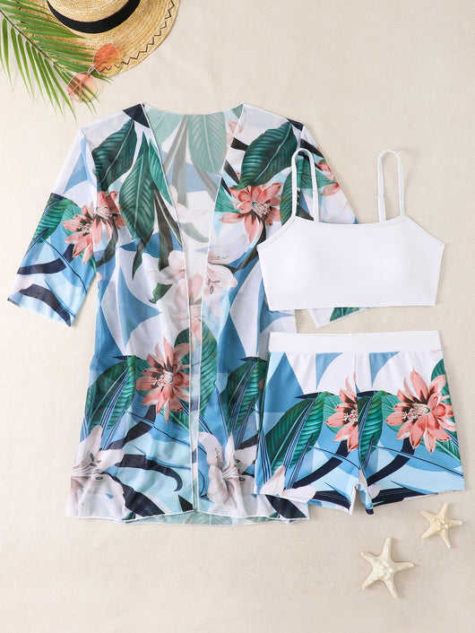 Woman in a three-piece bikini swimsuit set with a black tube top, floral boy shorts, and a sheer floral kimono cover-up. - Image 41