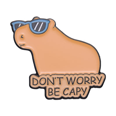 Cute capybara enamel brooch wearing a pink donut with sprinkles and "DONUT WORRY BE CAPPY" text. - Image 28