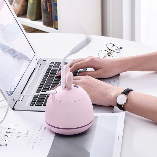 Cute pink rabbit desktop mini USB humidifier with a silver band, featuring a compact egg shape and bunny ears. - Image 7