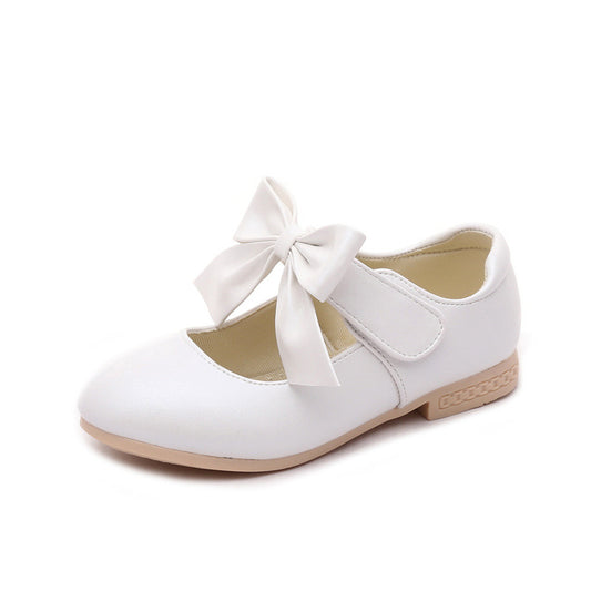 Gold Mary Jane shoes for girls with a large decorative bow on the strap and a low, comfortable heel. - Image 2
