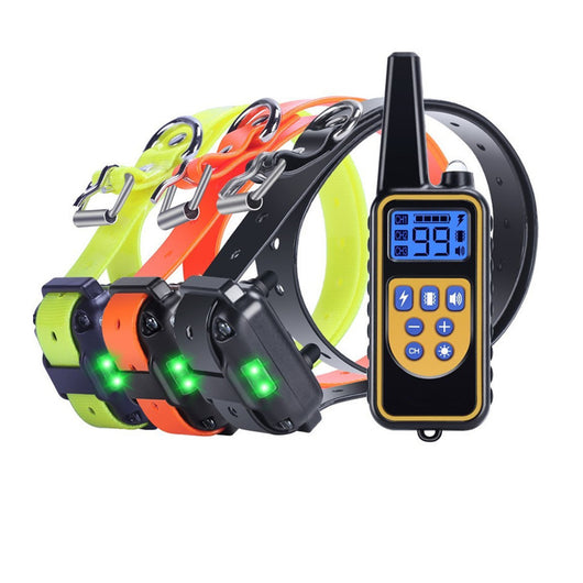 Three electric dog training collars in black, orange, and yellow with receivers, alongside a black and yellow remote control. - Image 4