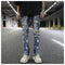 Jeans Slim Fit Elásticos con Detalles Graffiti y Rotos