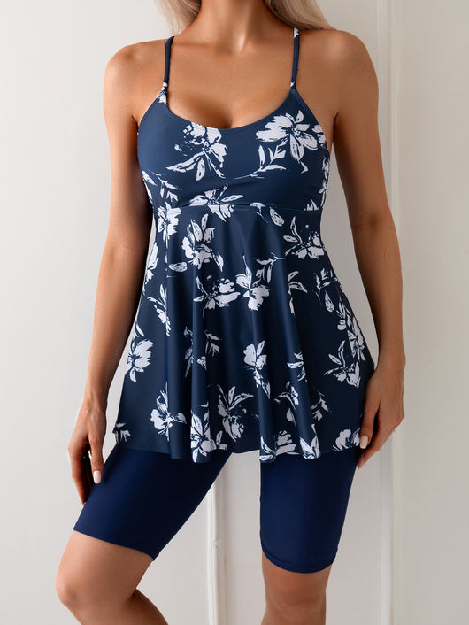 Women's navy blue two-piece swimsuit with white floral tankini top and matching solid swim shorts. - Image 20