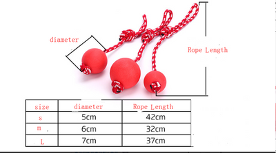 Three red rubber pet balls of varying sizes, attached to a red and white braided rope, for chewing and play. - Image 5