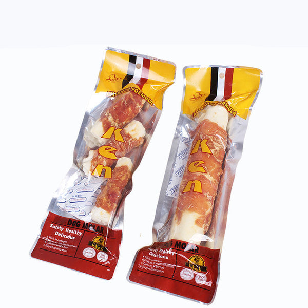 Two packages of chicken-wrapped cowhide roll dog treats, labeled 'Safety Healthy Delicious', on a white background.