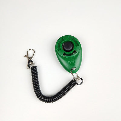 Turquoise dog training clicker with a black button and paw print, attached to a black coiled lanyard with a silver lobster clasp. - Image 4