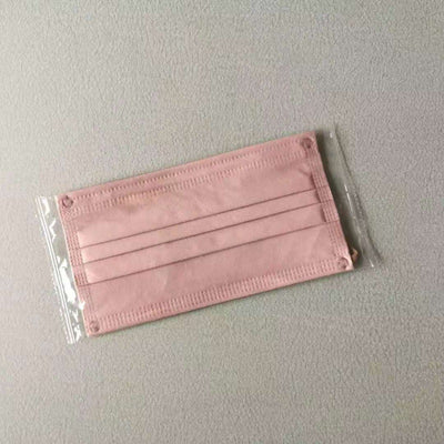Light pink disposable face mask with white ear loops, featuring pleats for a comfortable fit. - Image 9