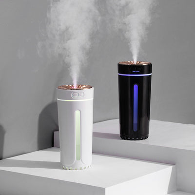 Pink cylindrical USB humidifier with a colorful light diffuser, control buttons, and a single fog outlet. - Image 11