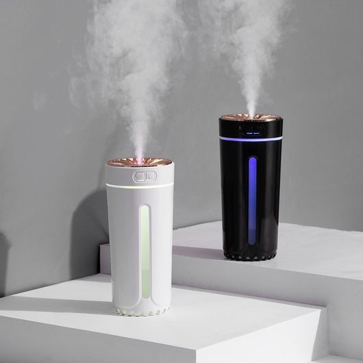 Pink cylindrical USB humidifier with a colorful light diffuser, control buttons, and a single fog outlet. - Image 11