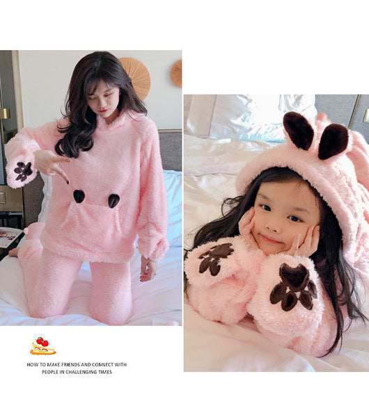 Mother and child wearing matching brown plush bear pajamas with hoods, ears, and embroidered paw gloves. - Image 13