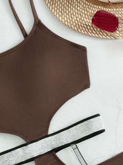 Pink one-piece swimsuit with side cut-outs and sparkling silver garter straps, modeled by a woman. - Image 10