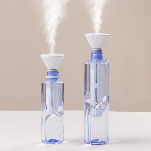 Beige and white USB ultrasonic humidifier with a fluted conical top and a cylindrical body with a water level window. - Image 5
