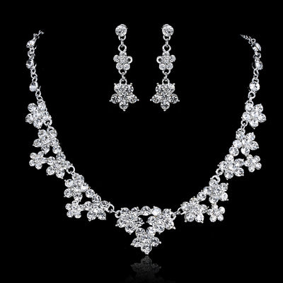 Silver-toned bridal tiara with clear rhinestones in a delicate floral and leaf design, perfect for weddings. - Image 3