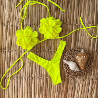 Neon yellow women's bikini with 3D floral details on the triangle top and a high-cut bottom.