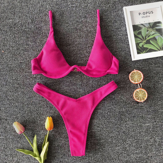 Neon green ribbed two-piece swimsuit with an underwire bikini top and high-cut bottoms on a dark grey background. - Image 19