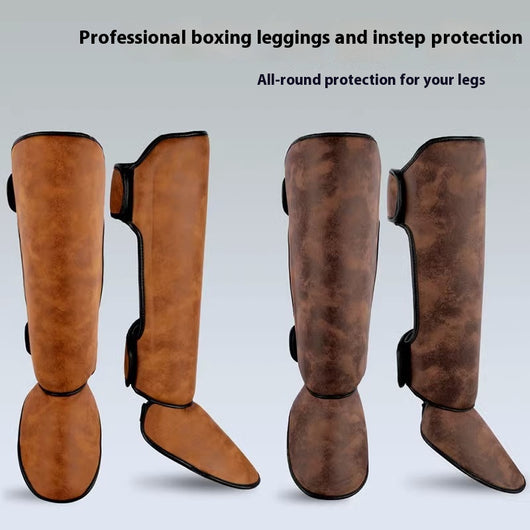 Pair of brown and black thickened shin guards for fighting and boxing, featuring a distressed leather-like texture.